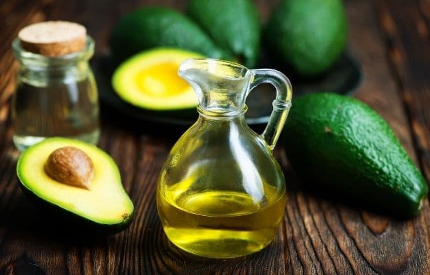 two avocado oil jugs combining with avocados | Avocado Oil | The Healthiest 7 Vegan Cooking Oils