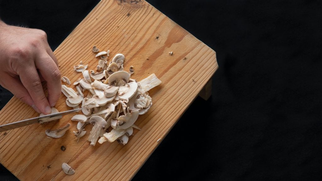 chopping shitake mushrooms